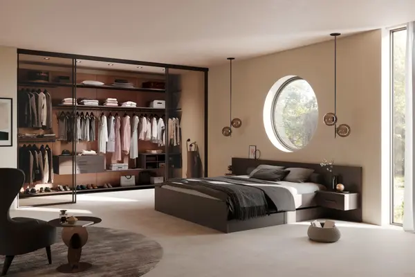 Modernes Schlafzimmer mit begehbarem Kleiderschrank, runder Fensterfront und stilvollem Design.